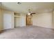 Bedroom featuring carpet, a ceiling fan, and two closets for extra storage at 8448 Cambria Cellars Ct, Las Vegas, NV 89139
