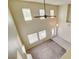 Bright entryway showcases high ceilings, natural light through large windows, and tile that transitions to comfortable carpeting at 8448 Cambria Cellars Ct, Las Vegas, NV 89139