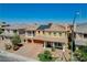 A stunning home showcasing a manicured lawn, grand pillars, and solar panels at 8448 Cambria Cellars Ct, Las Vegas, NV 89139