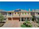 Inviting home with a well-manicured front yard, spacious three car garage, and solar panels on the roof at 8448 Cambria Cellars Ct, Las Vegas, NV 89139