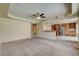 Expansive living room seamlessly connects to an open kitchen with granite countertops and stainless-steel appliances at 8448 Cambria Cellars Ct, Las Vegas, NV 89139
