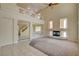 Bright living room with fireplace, carpeted floors, and large windows, creating a warm and inviting atmosphere at 8448 Cambria Cellars Ct, Las Vegas, NV 89139