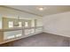 Upper-level loft features neutral carpet, glass railings, and a view to the entry, promoting an open and airy feel at 8448 Cambria Cellars Ct, Las Vegas, NV 89139