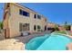 Backyard view of a beautiful pool and patio, perfect for outdoor entertaining and relaxation on a sunny day at 8448 Cambria Cellars Ct, Las Vegas, NV 89139