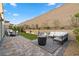An expansive backyard with distinct lounging and dining areas, perfect for entertaining and relaxation at 8705 Fordster St, Las Vegas, NV 89166