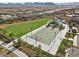 Aerial view of basketball court with neighborhood homes in the background at 8705 Fordster St, Las Vegas, NV 89166