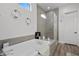Modern bathroom featuring a sleek tub and glass-enclosed shower for a luxurious experience at 8705 Fordster St, Las Vegas, NV 89166