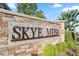 Stone Skye Mesa community entrance sign surrounded by lush greenery at 8705 Fordster St, Las Vegas, NV 89166