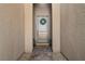Inviting front entrance with a decorative wreath, paved walkway, and neutral-colored walls at 8705 Fordster St, Las Vegas, NV 89166