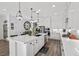 Spacious kitchen with white cabinets, a large island, and stainless steel appliances at 8705 Fordster St, Las Vegas, NV 89166