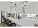 Bright kitchen with an island, quartz countertops, and stainless steel appliances at 8705 Fordster St, Las Vegas, NV 89166