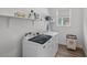 Well-lit laundry room with modern washer and dryer at 8705 Fordster St, Las Vegas, NV 89166