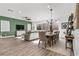 Bright and open living and dining area with hardwood floors and view to the outdoor area at 8705 Fordster St, Las Vegas, NV 89166