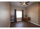 Bedroom featuring wood floors, a ceiling fan, and a large window at 878 Samoy St, Las Vegas, NV 89110