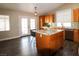 Bright kitchen features an island with barstool seating and direct access to outdoor patio at 878 Samoy St, Las Vegas, NV 89110