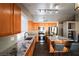Bright kitchen featuring granite countertops, stainless steel appliances, and a center island with bar seating at 878 Samoy St, Las Vegas, NV 89110