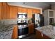 Close-up of the kitchen with stainless steel appliances and granite countertops at 878 Samoy St, Las Vegas, NV 89110