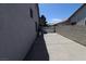 Home's side yard features a long concrete space and block wall at 878 Samoy St, Las Vegas, NV 89110