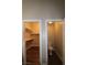 Walk-in closet and water closet featuring wood floors and built-in shelving at 878 Samoy St, Las Vegas, NV 89110