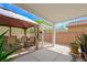 Outdoor patio space with dining set and shade canopies at 9104 Ashiwi Ave, Las Vegas, NV 89178