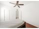 Bedroom with wood floors, closet, and ceiling fan at 9104 Ashiwi Ave, Las Vegas, NV 89178
