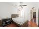 Bedroom featuring a ceiling fan and wood floors at 9104 Ashiwi Ave, Las Vegas, NV 89178