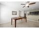 Open dining area with tile flooring and a view of the kitchen, ideal for Gathering meals and gatherings at 9104 Ashiwi Ave, Las Vegas, NV 89178