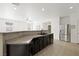 Stylish kitchen with granite countertops, stainless steel appliances, and a breakfast bar for casual dining at 9104 Ashiwi Ave, Las Vegas, NV 89178