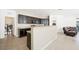Well-equipped kitchen with dark cabinetry, breakfast bar, and stainless steel appliances for the cooking enthusiast at 9104 Ashiwi Ave, Las Vegas, NV 89178