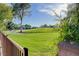 Beautiful view of a meticulously maintained green space with a walking path and mature trees on a sunny day at 945 Vegas Valley Dr, Las Vegas, NV 89109