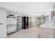 Spacious kitchenette featuring modern appliances, tile floors, and a wine refrigerator at 945 Vegas Valley Dr, Las Vegas, NV 89109