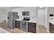 Modern kitchen featuring stainless steel appliances, two-tone cabinets, and a sleek countertop at 9604 Stoney Mesa Ct, Las Vegas, NV 89139
