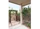 Charming backyard gate with mature foliage and stone pathway at 9621 Donner Springs Ave, Las Vegas, NV 89148