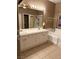 Bathroom features double sinks, vanity, and soaking tub with tile floors at 9621 Donner Springs Ave, Las Vegas, NV 89148
