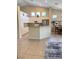 Spacious kitchen with center island features granite counters, white cabinets, and stainless-steel appliances at 9621 Donner Springs Ave, Las Vegas, NV 89148