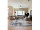 Bright living room featuring tile floors, fan, and sliding glass doors that lead to the backyard at 9621 Donner Springs Ave, Las Vegas, NV 89148