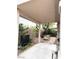 Relaxing covered patio area with a garden, fountain, and comfortable seating at 9621 Donner Springs Ave, Las Vegas, NV 89148
