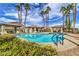 Resort style pool area with tropical landscaping and cabanas with ample seating for residents to enjoy at 9621 Donner Springs Ave, Las Vegas, NV 89148