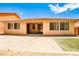 Backyard with brick pavers and artificial turf near the back of the house at 9987 Shiloh Heights St, Las Vegas, NV 89178