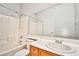 Bright bathroom featuring a tub and shower combination with modern white tiling at 9987 Shiloh Heights St, Las Vegas, NV 89178