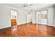 Large bedroom that features wood-look floors, with bathroom and patio access at 9987 Shiloh Heights St, Las Vegas, NV 89178