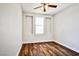 Cozy bedroom showcasing a window with decorative molding and wood-look flooring at 9987 Shiloh Heights St, Las Vegas, NV 89178