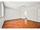 A bright bedroom with wood-look floors, with bathroom access at 9987 Shiloh Heights St, Las Vegas, NV 89178