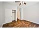 An airy bedroom featuring wood-look floors and a spacious closet at 9987 Shiloh Heights St, Las Vegas, NV 89178