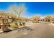 View of the gated community entrance with desert landscaping and neighborhood signage at 9987 Shiloh Heights St, Las Vegas, NV 89178
