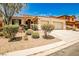 Charming single story home featuring a tile roof, a two car garage, and desert landscaping at 9987 Shiloh Heights St, Las Vegas, NV 89178
