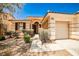 Charming single story home featuring a tile roof, desert landscaping and covered front entry at 9987 Shiloh Heights St, Las Vegas, NV 89178