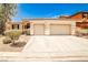 Charming single story home featuring a tile roof, a two car garage, and desert landscaping at 9987 Shiloh Heights St, Las Vegas, NV 89178