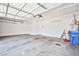 Well lit two car garage with overhead storage and epoxy flooring at 9987 Shiloh Heights St, Las Vegas, NV 89178