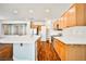 Well-lit kitchen featuring wood floors, stainless steel appliances, and a functional center island at 9987 Shiloh Heights St, Las Vegas, NV 89178